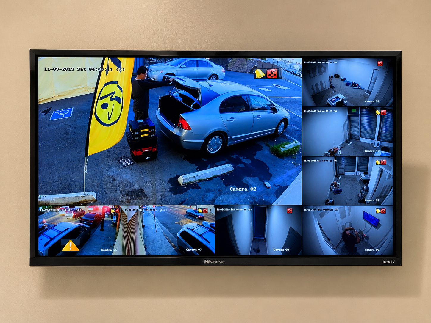 ISEEU TECHS installation: wall-mounted CCTV monitor displaying multiple live camera feeds