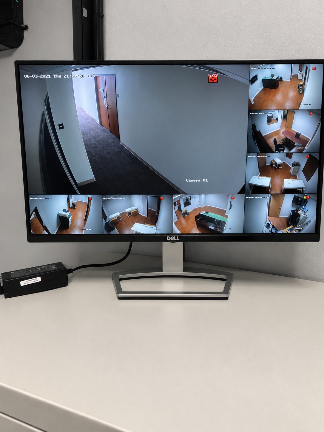 ISEEU TECHS installation: clean CCTV monitoring station showing live office camera views